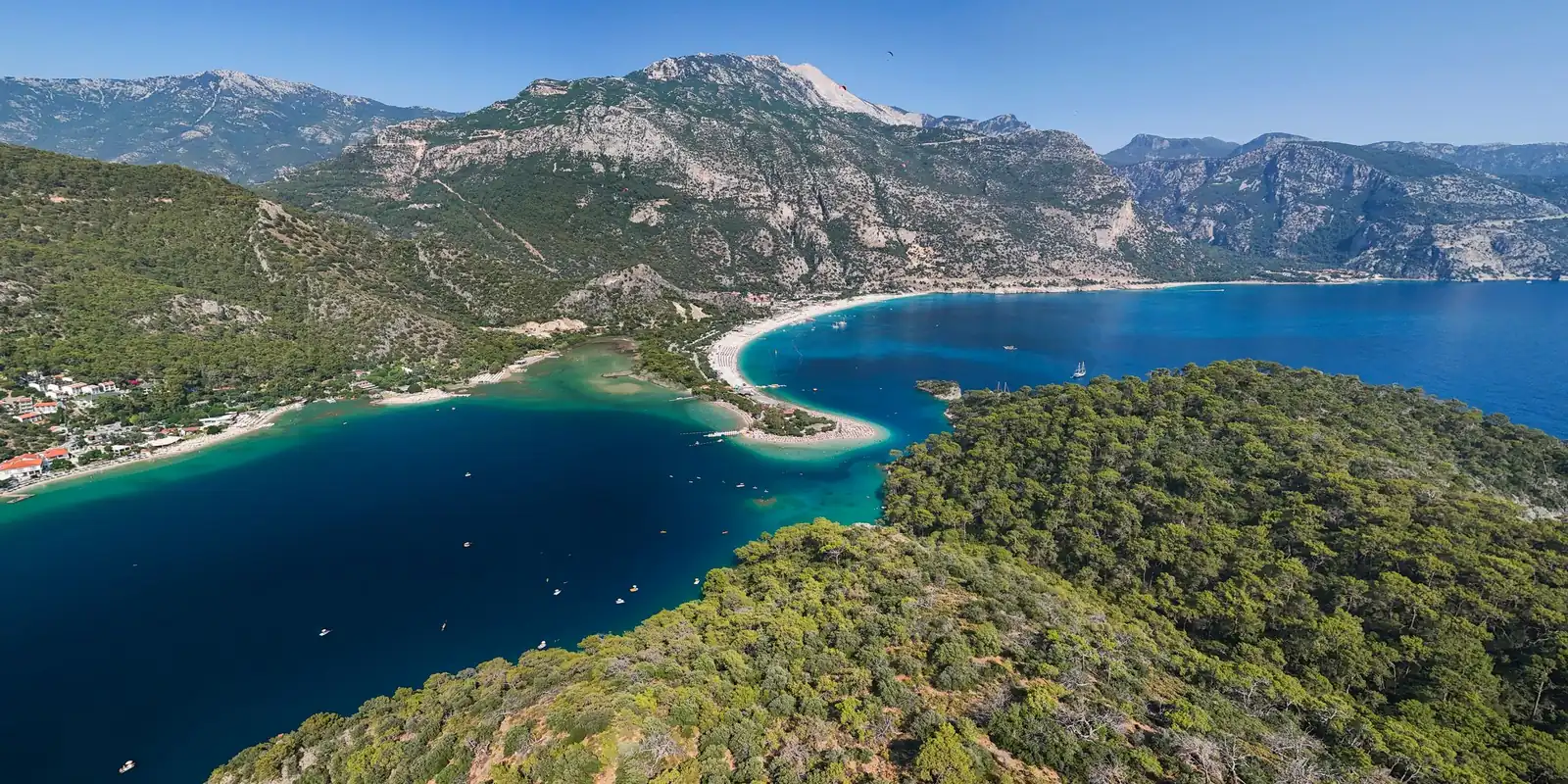 Ölüdeniz lagoon and the pine-covered Lycian coast with Babadağ rising behind, near Fethiye